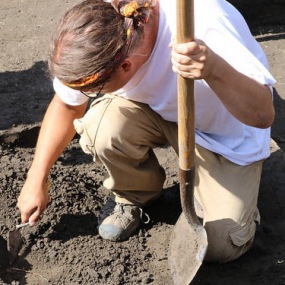 an archaeologist digging